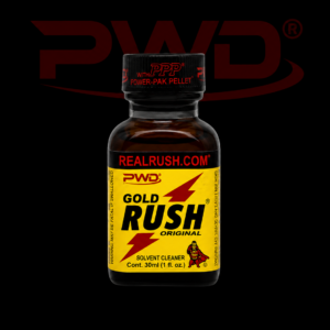 Promotional image of a 30ml bottle of PWD Gold Rush Original solvent cleaner with a bright yellow label, red lightning bolt graphics, ‘REALRUSH.COM’ branding, and a black PPP Power-Pak Pellet cap, displayed against a black background with a large red PWD logo.