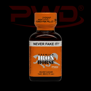 Promotional image of a 30ml bottle of PWD Premium Iron Horse solvent cleaner with an orange label featuring a white horse graphic, ‘NEVER FAKE IT!’ branding, and an orange PPP Power-Pak Pellet cap, displayed against a black background with a large red PWD logo.