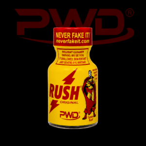 Promotional image of a small yellow bottle of PWD Rush Original solvent cleaner with red lightning bolt graphics, a comic-style superhero illustration, warning labels, and the slogan ‘NEVER FAKE IT!’ on the cap, displayed against a black background with a large red PWD logo.