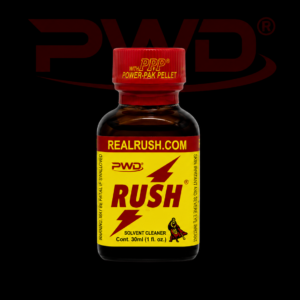 Promotional image of a 30ml bottle of PWD Rush solvent cleaner with a bright yellow label, red lightning bolt graphics, ‘REALRUSH.COM’ branding, and a red PPP Power-Pak Pellet cap, displayed against a black background with a large red PWD logo.